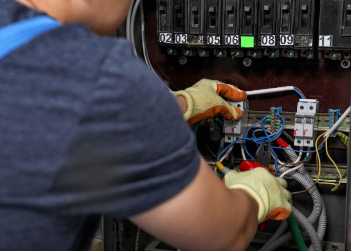 electrician checks the electricity for maintenance